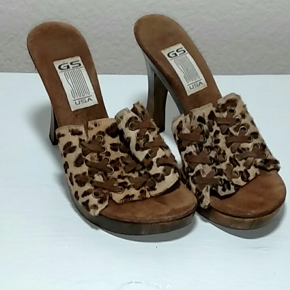 Kitty print mules.